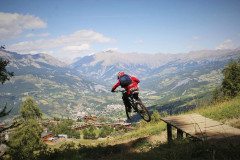 Hitting a jump in the Pra Loup Bikepark