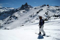 Snowboarder sets off down an empty piste in Courcheval