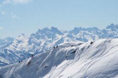 Snowboarders dropping in to some seriously steep terrain in La Grave