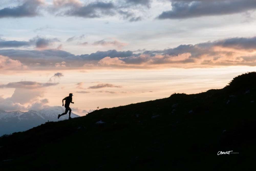 Rémi Berchet runs along a high mountain trail in the French Alps