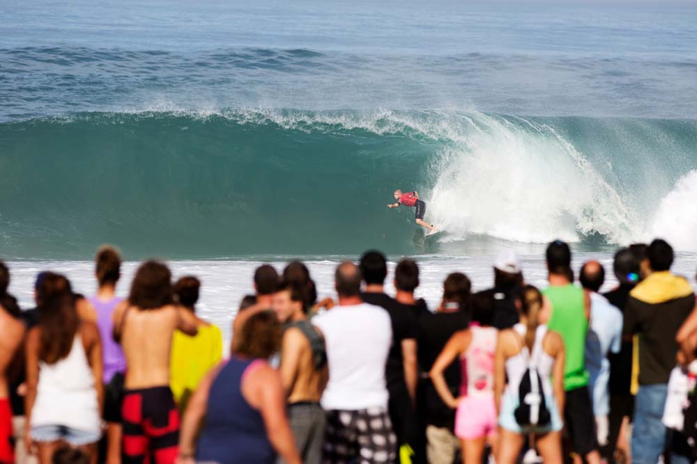 Surfer Mick Fanning sets up for the barrel at the Quik Pro France in Seignosse