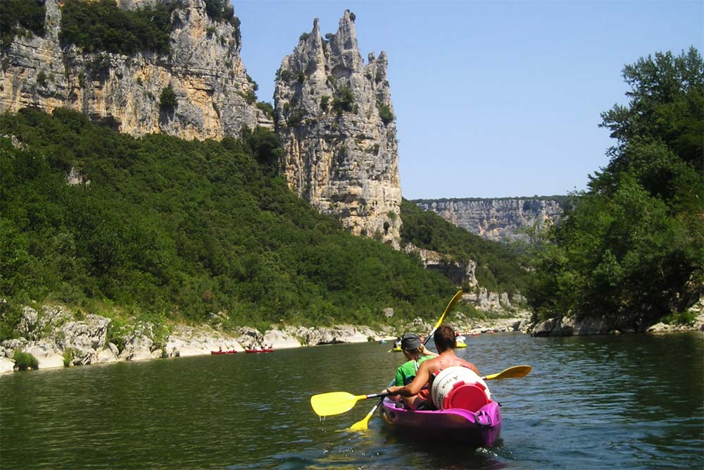 Canoeing past Cathedral Rock in the Ardèche