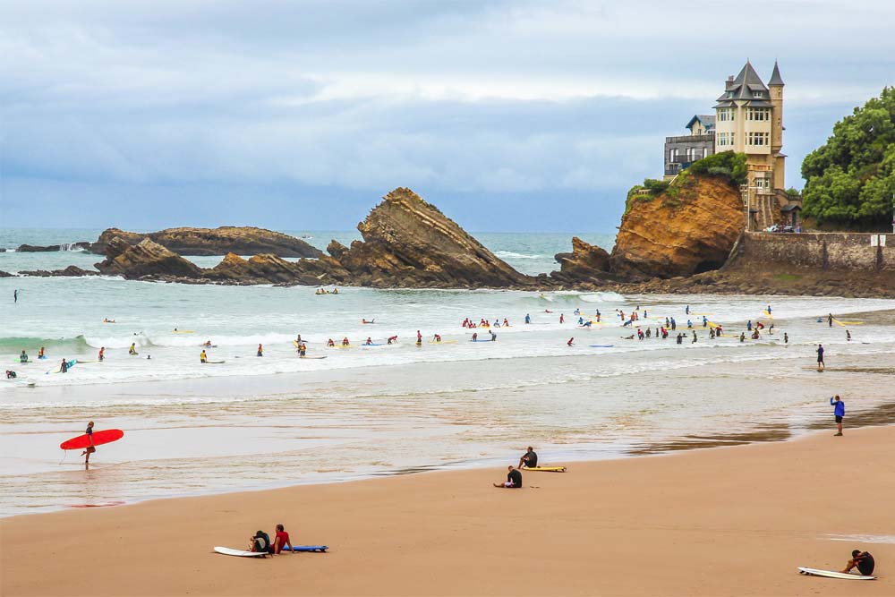 Surfers enjoy the Côte des Basques beach in Biarritz