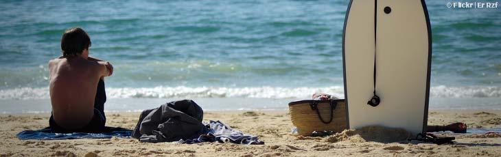 Surfer waiting for waves at La Salie in Arcachon