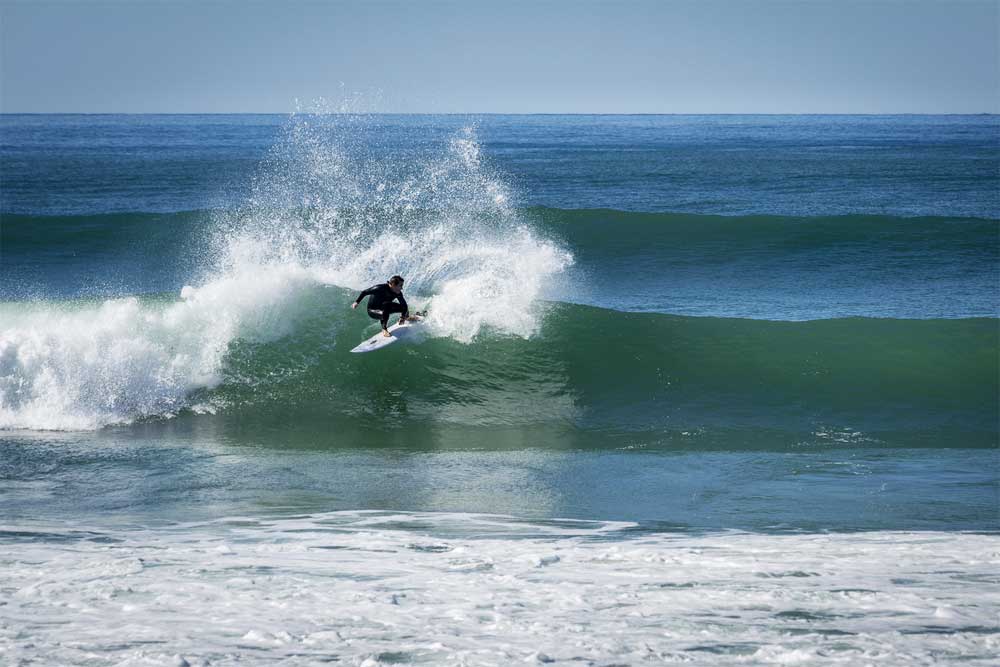 Surfer carves up a wave at Biscarrosse Plage