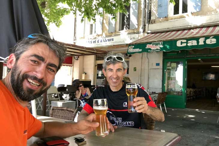 Mountain bikers enjoy celebratory beers in Saint-Étienne-les-Orgues