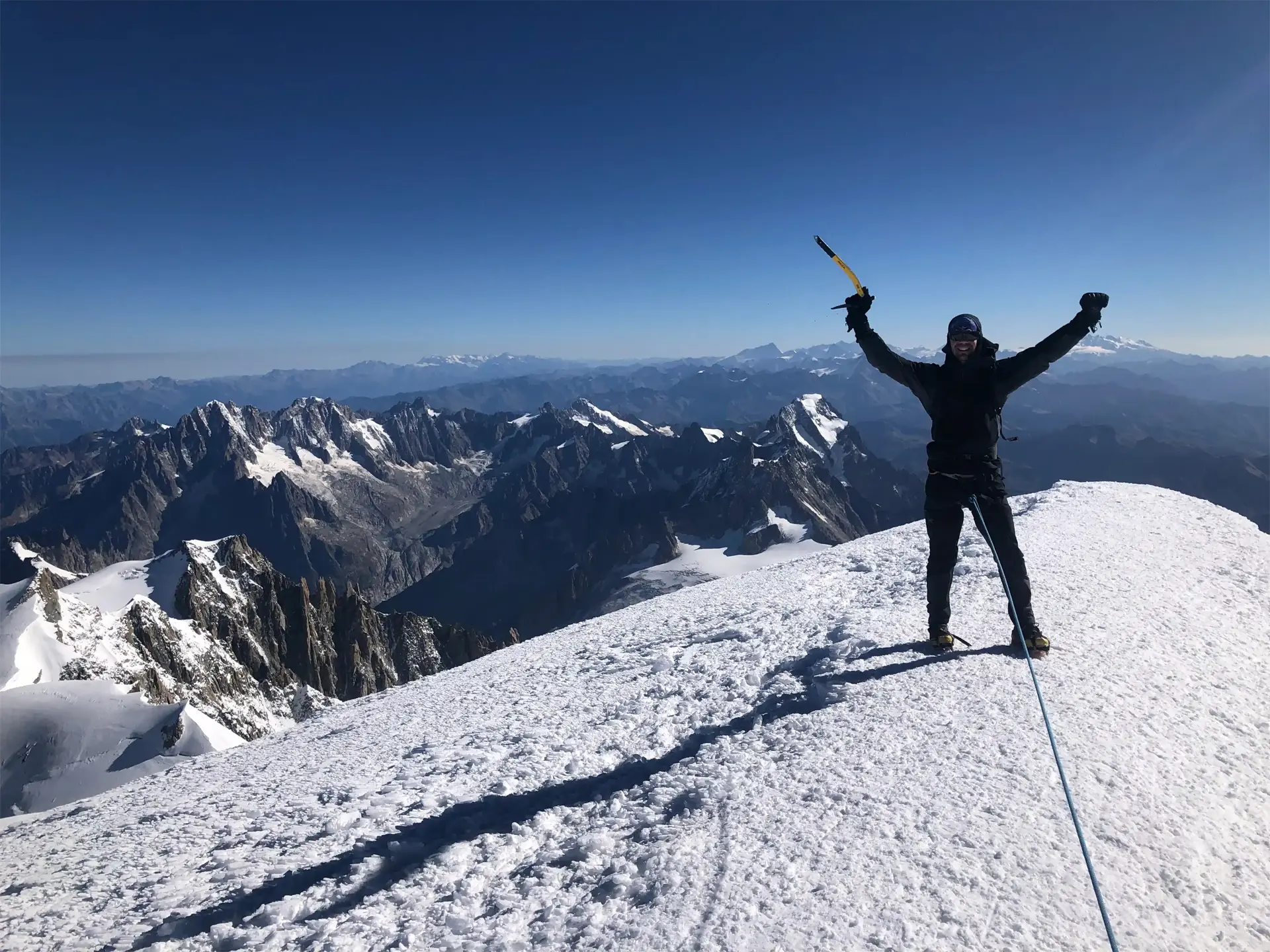 Mont Blanc summit climb Climber on the summit of Mont Blanc