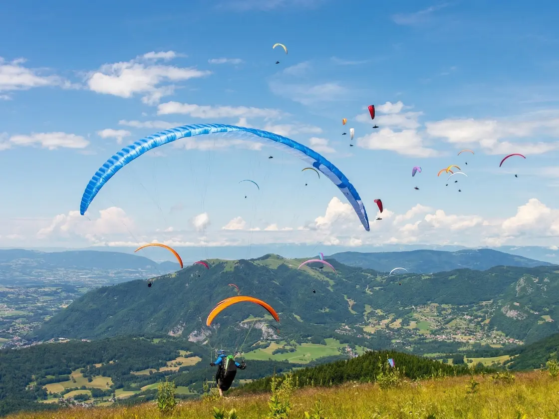 Paragliders taking off from La Platière in Mieussy