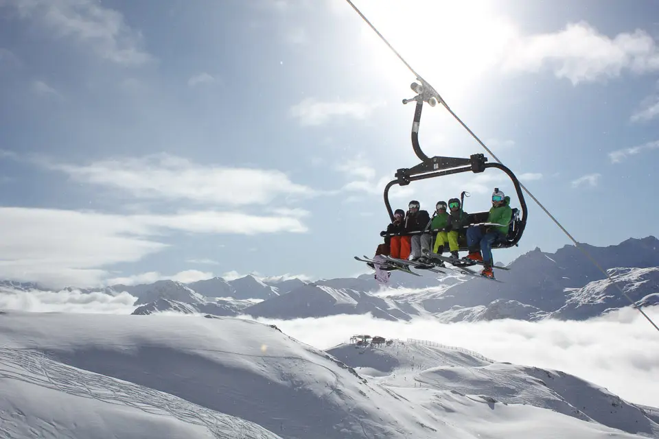 Skiers taking the chairlift in Tignes