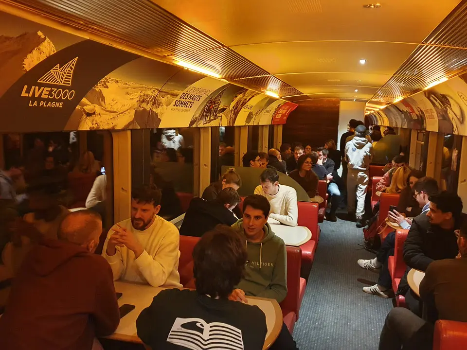 The Travelski Night Express restaurant bar with red leather seating