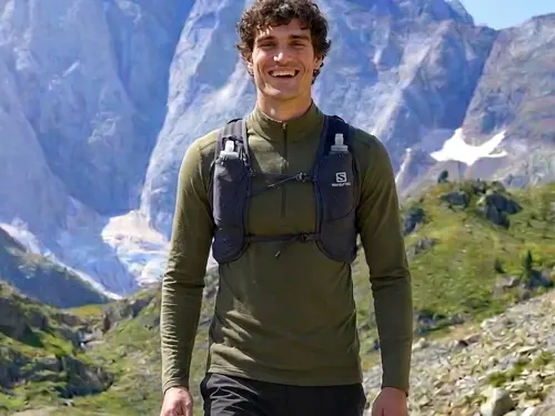 Best Base Layers for Hiking Marc hiking in the Pyrenees wearing an Ice Breaker merino base layer