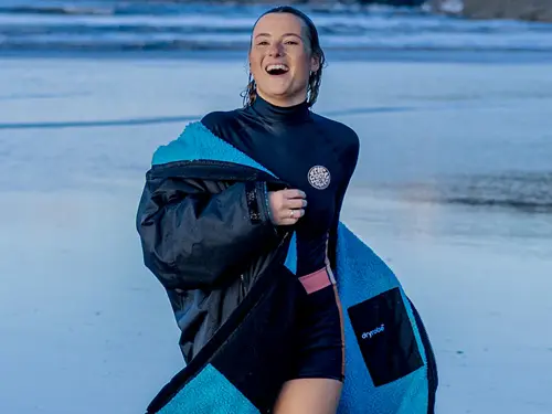 Dryrobe Advance Changing Robe Female surfer wearing a Dryrobe Advance Changing Robe