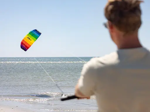 HQ Symphony Trainer Kite Man flying an HQ Symphony trainer kite