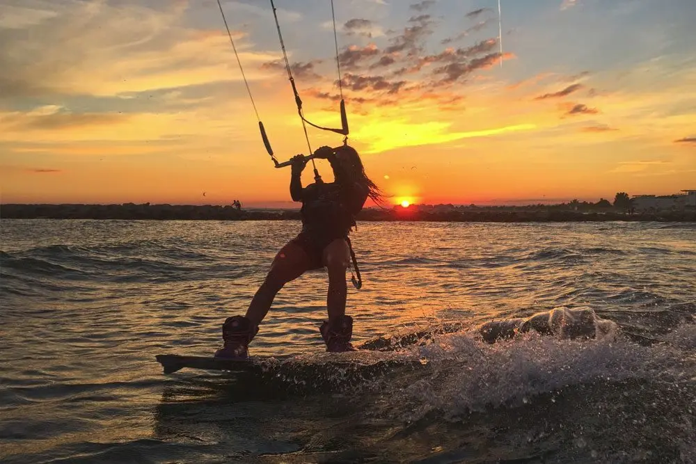 Kitesurfing at sunset in the South of France Kitesurfing at sunset in the South of France
