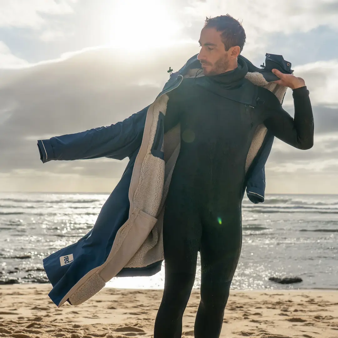 Surfer showing off the Red Pro Change EVO sherpa fleece lining