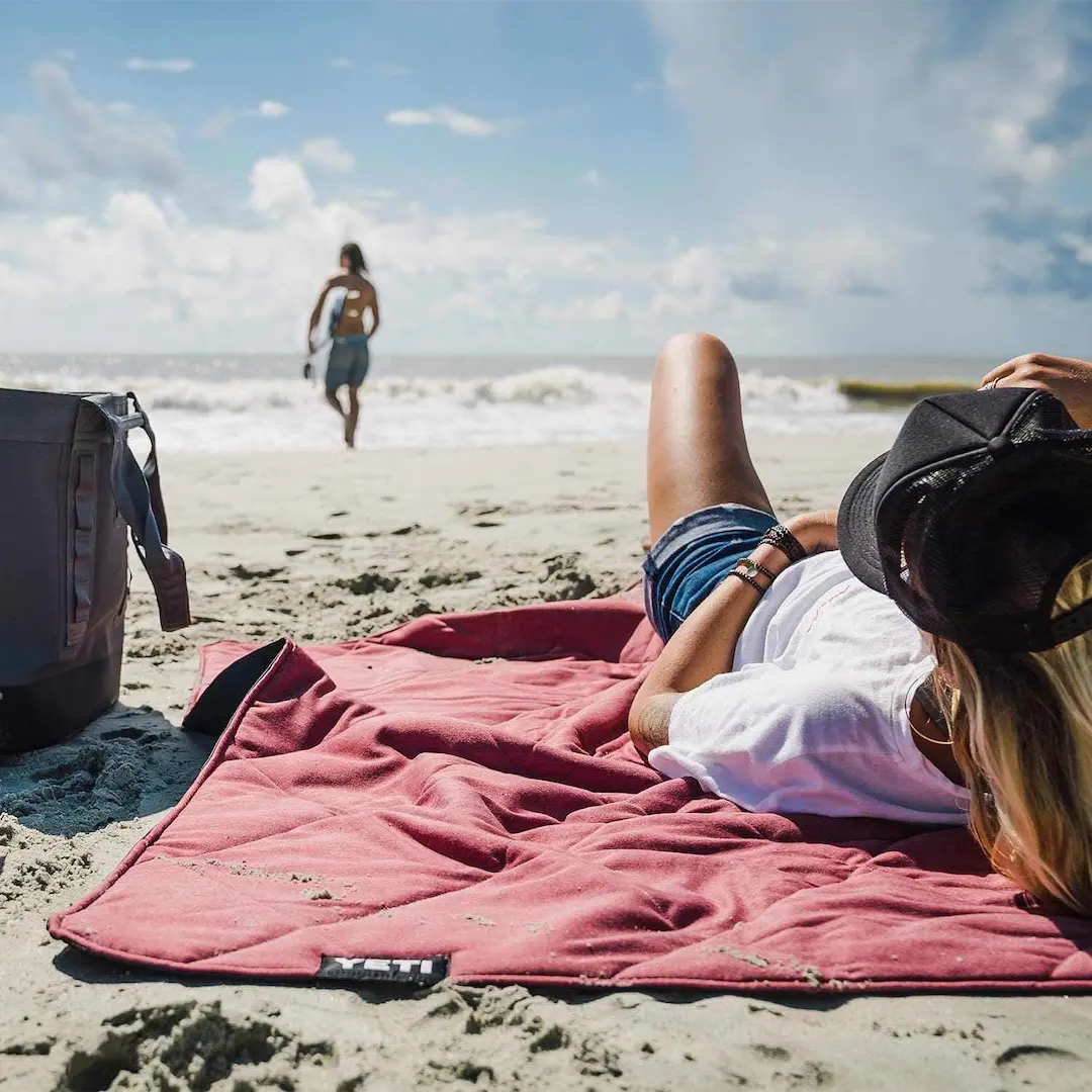On the beach with the YETI Lowlands Camping Blanket