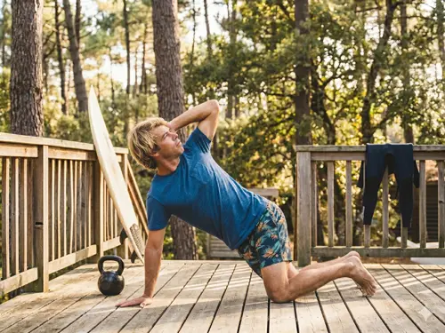 Mobilise - Thoratic Mobility Routine for Surfers Surfer performing a thoracic mobility exercise