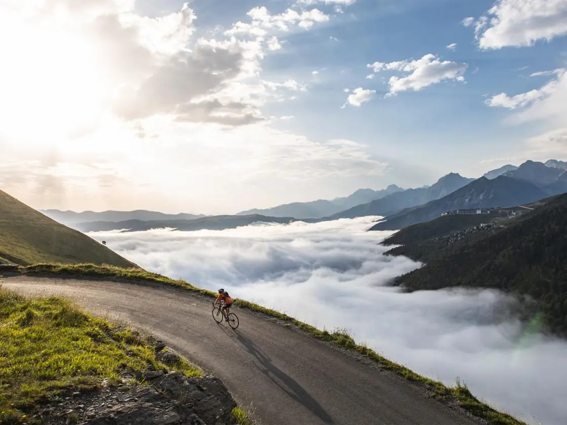 Road cyclist on the high mountain road of the Col de Portet above Saint-Lary
