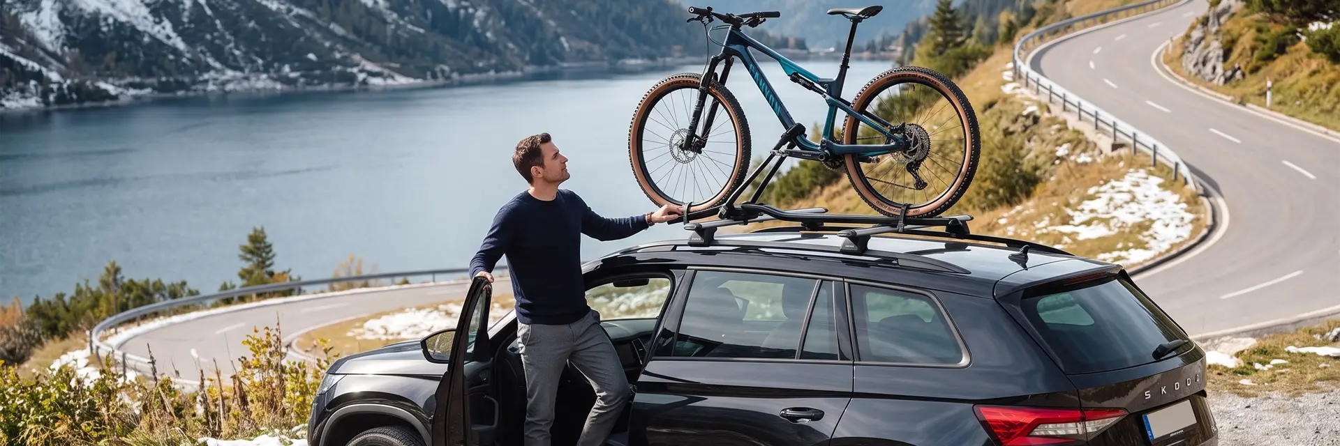 france-car-rental Man checks his bike rack on a Skoda Kodiac hire car in France