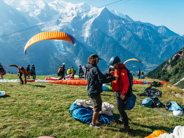 Tandem paragliding flight above the Chamonix valley beneath Mont Blanc