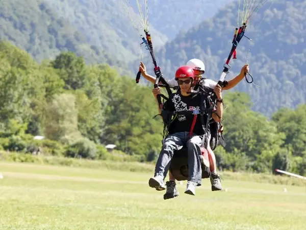 Tandem paraglider above Bagnères-de-Luchon in the French Pyrenees Tandem paraglider above Bagnères-de-Luchon in the French Pyrenees