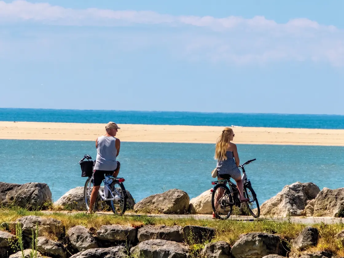 Two people enjoying a cycle ride in Royan, France