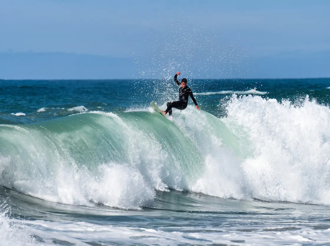 A surfer floats over a closeout wave on Ile de Ré