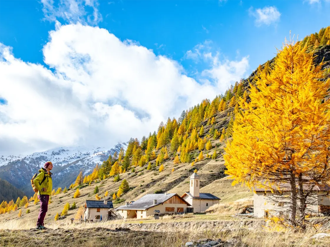 Hiking in a larch village with painted sundials in the Queyras on the GR5