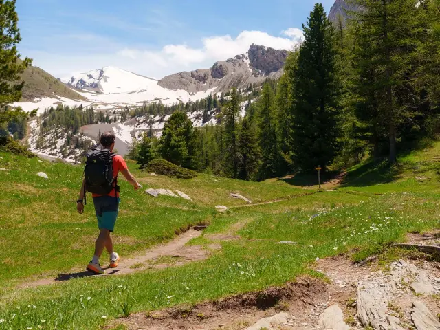 Summer hiking in the Queyras Hiker on the GR58 trail in the Queyras regional nature park