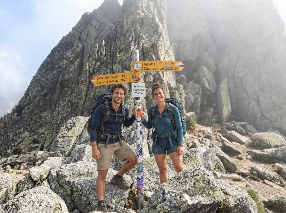 Hikers reach the Fenêtre d'Arpette mountain pass on the Tour du Mont Blanc